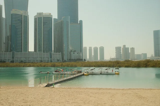 Abu Dhabi waterfront with beach and distant residential towers